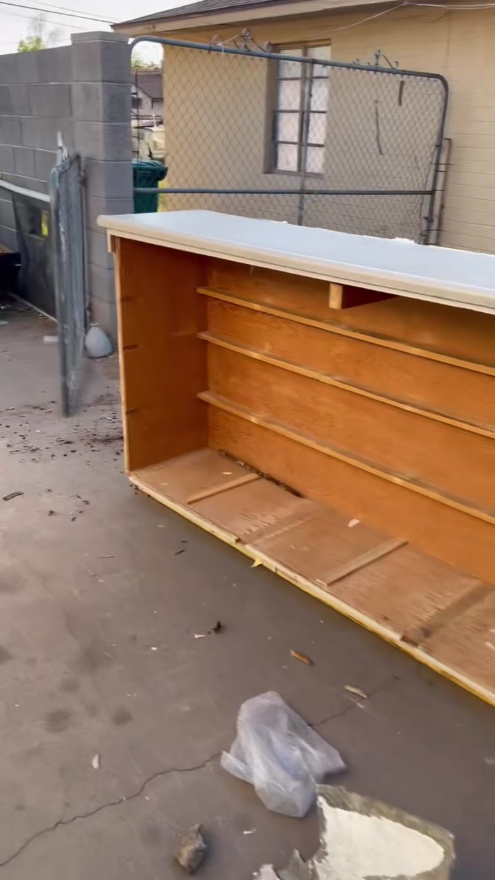 Wood shelving unit removed during cleanout