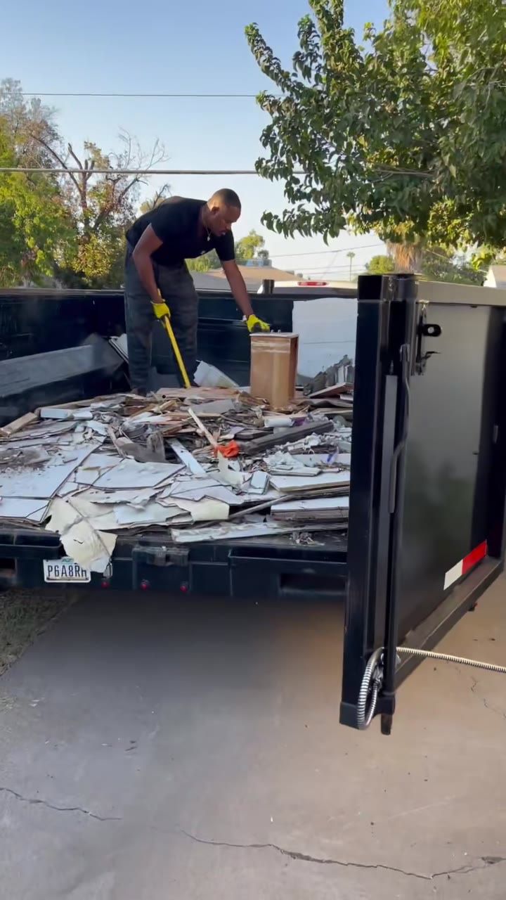 Loading demo debris into the trailer